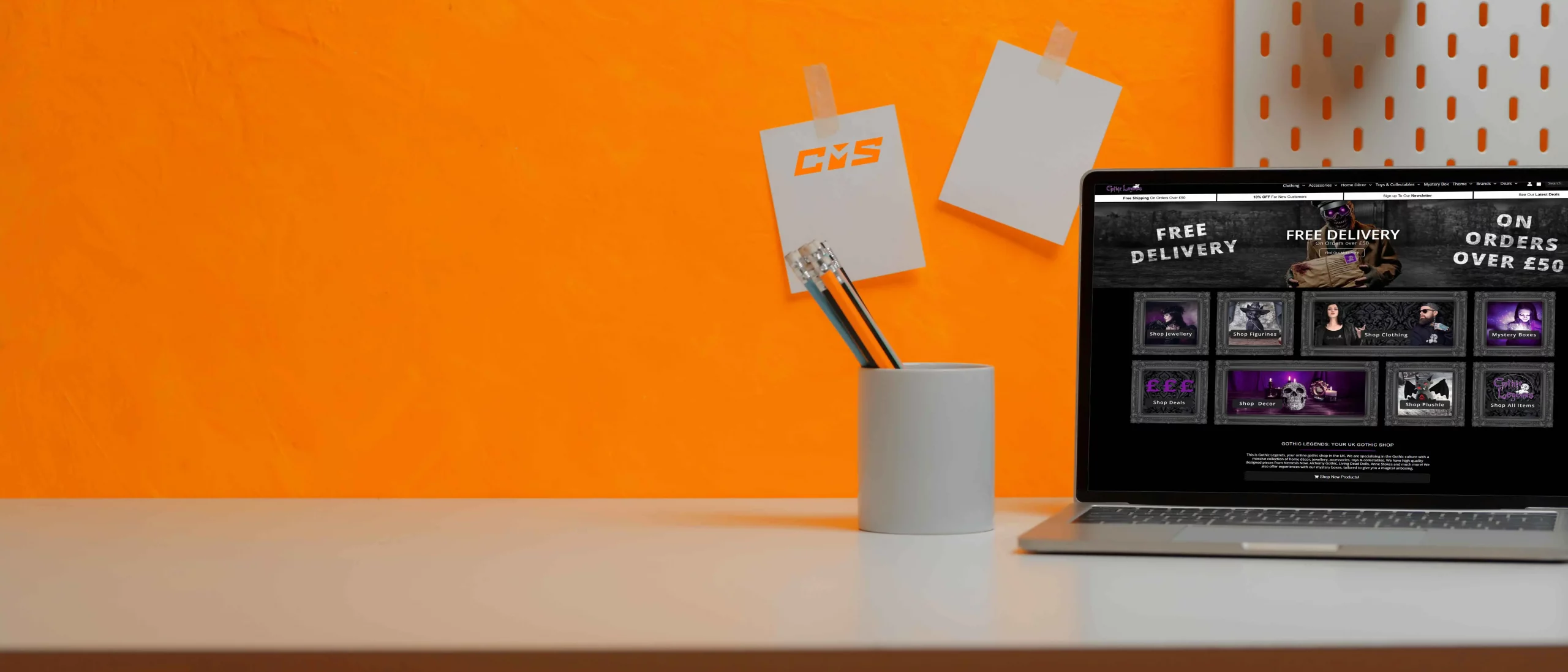 Laptop with ecommerce website and CMS branding, perfect workspace for online store management